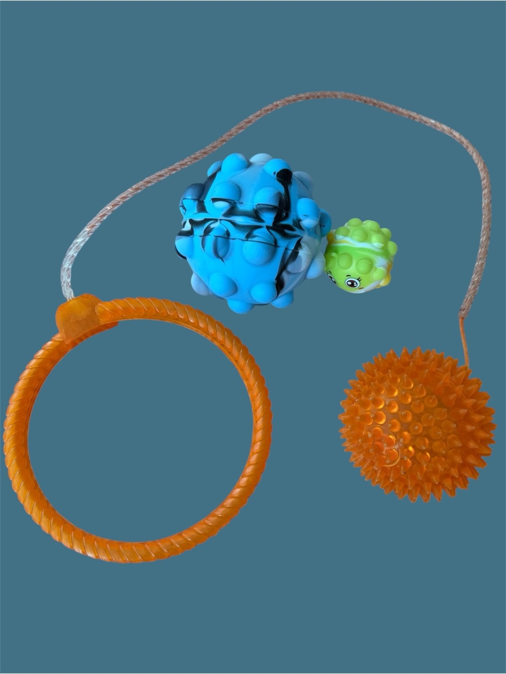 Set of three distinct sensory and activity toys